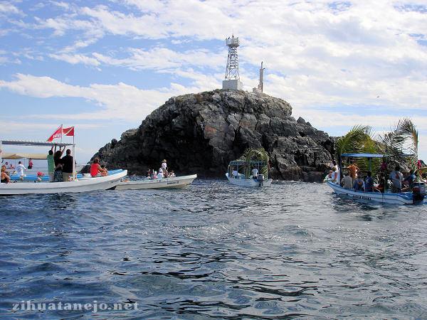 Flotilla of pangas at La Piedra Solitaria